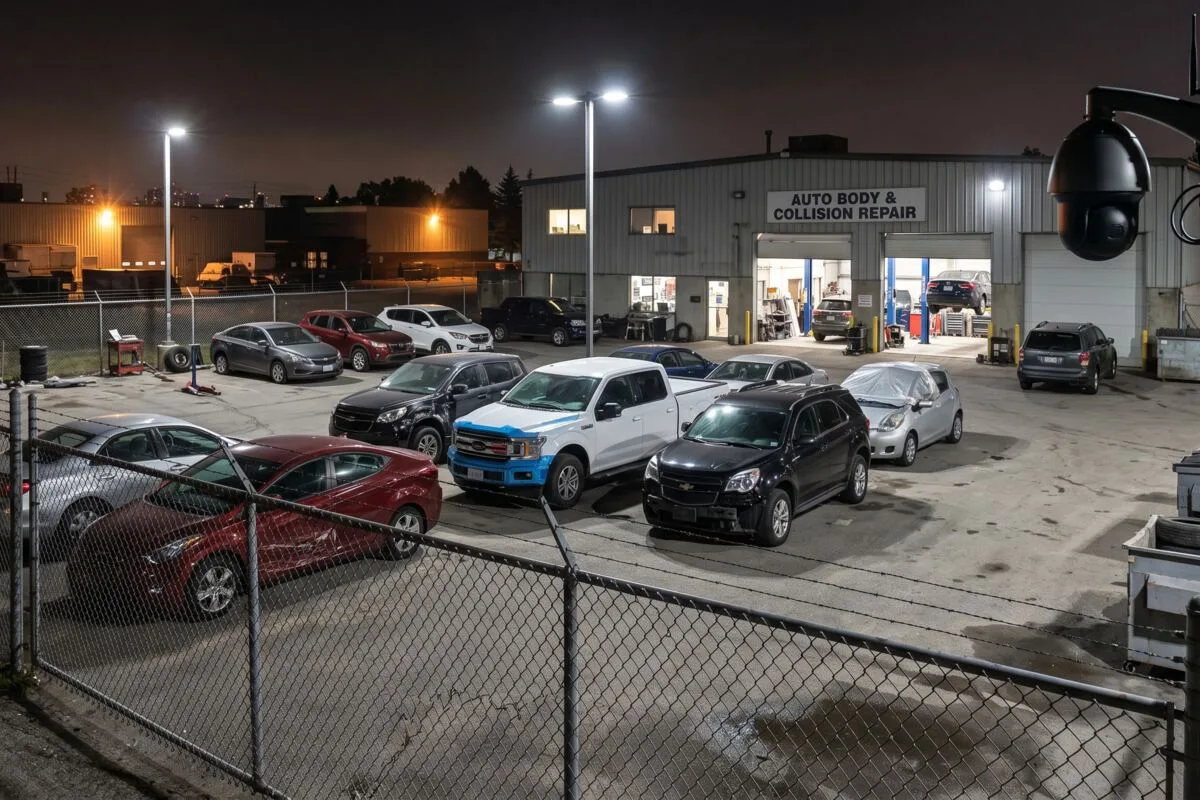 Security cameras monitoring the vehicle lot and entrance of an auto body shop in Ontario